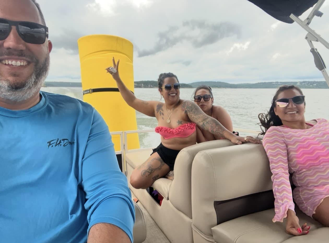 Jason and friends on a pontoon boat